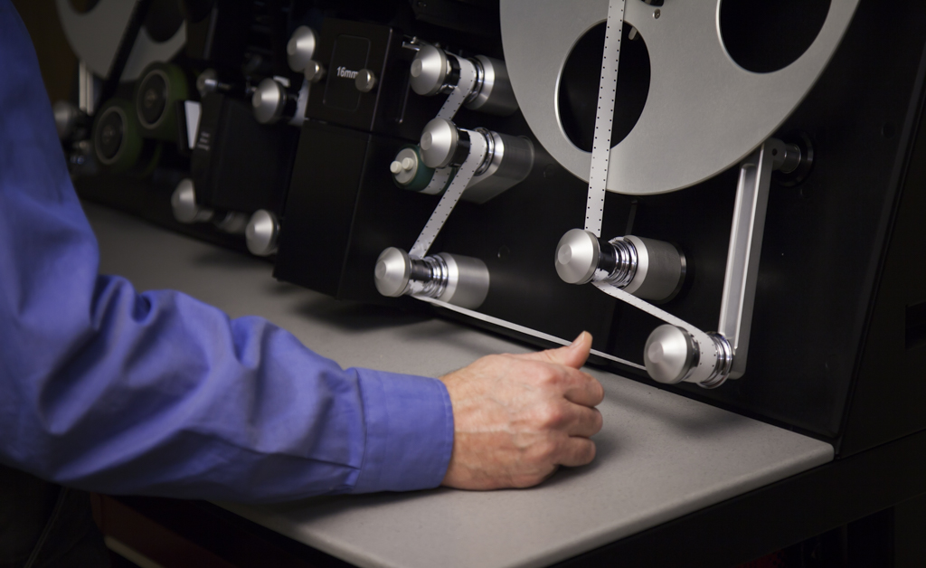 Engineer Boyd Hillestad operates the Lasergraphics ScanStation film scanner.