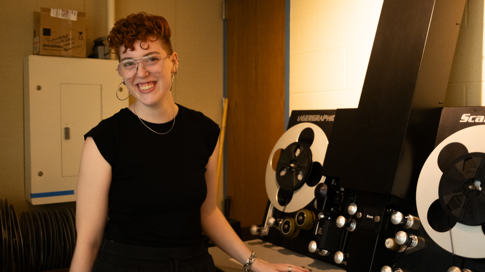 Sophie Mayer stands by the Lasergraphics ScanStation film scanner.