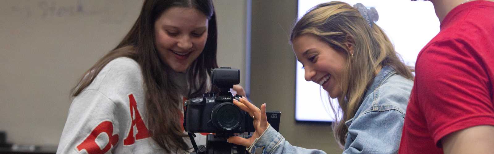 Students working with a camera in CA355.